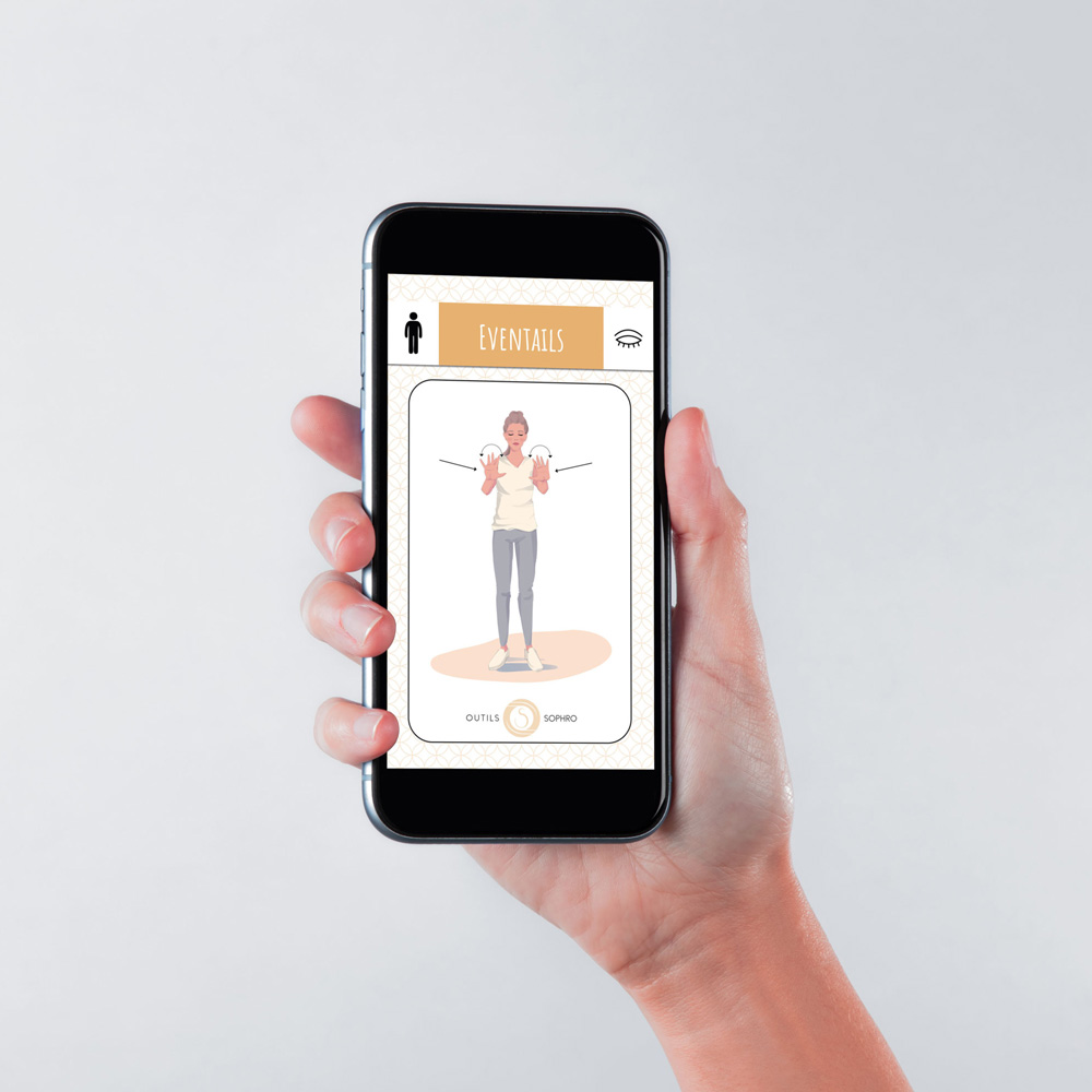Hand holding a smartphone displaying a mobile app screen with an illustration of a person standing with raised hands inside a bordered card.